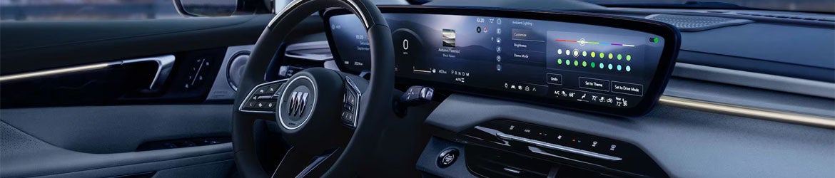 2026 Buick Enclave steering wheel and instrument panel in Quincy IL featuring digital displays, driver controls, and premium finishes