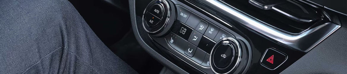 2026 Buick Envista center console interior detail in Quincy IL featuring modern digital layout, storage space, and driver-focused controls