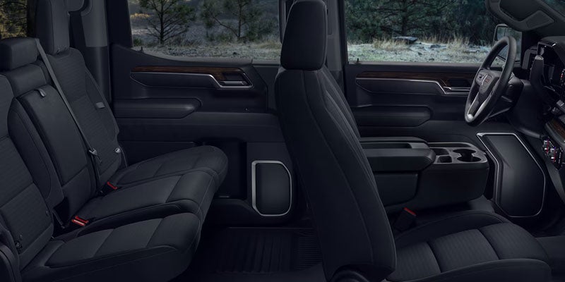 Interior of the 2026 GMC Sierra 1500 in Quincy, IL with spacious Crew Cab seating, premium materials, center console storage, and advanced comfort features.