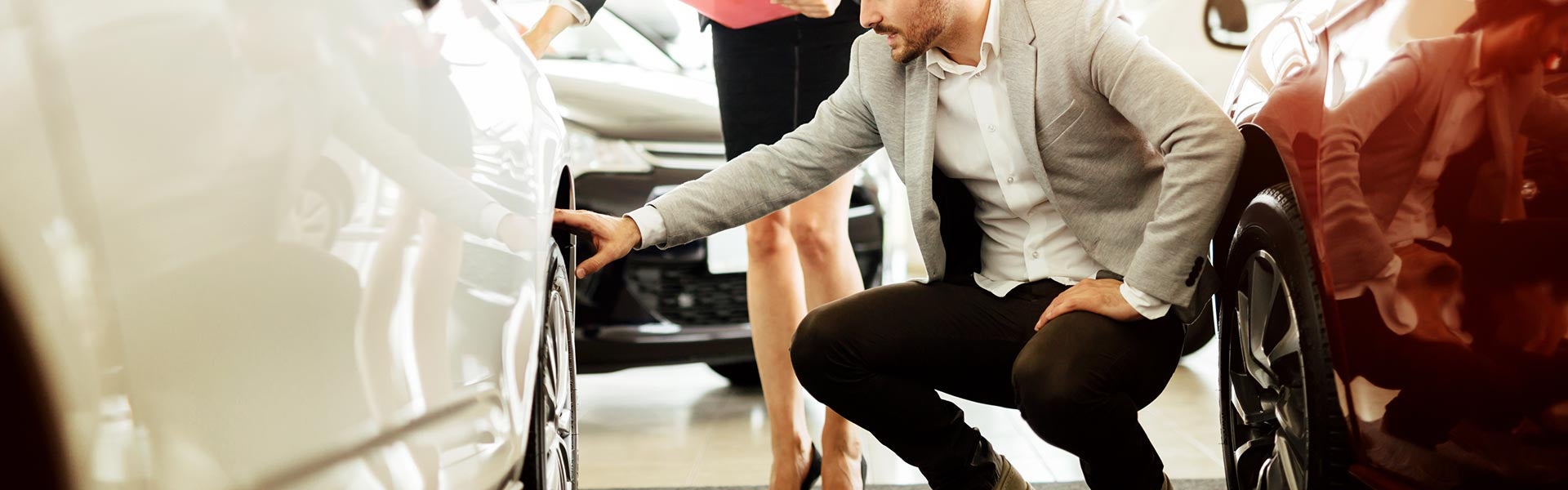 People examining a car