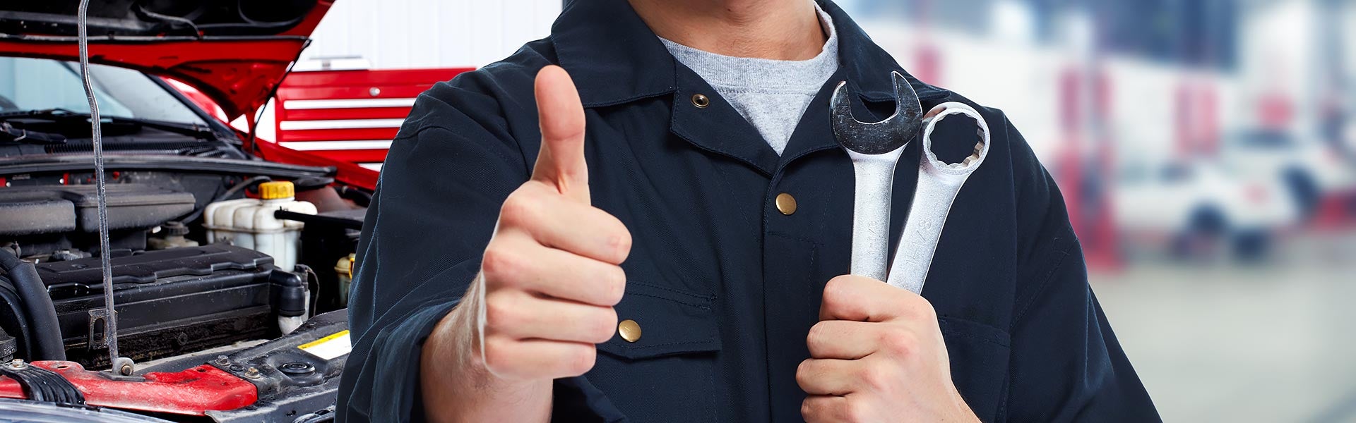 Mechanic with wrench doing a thumbs up