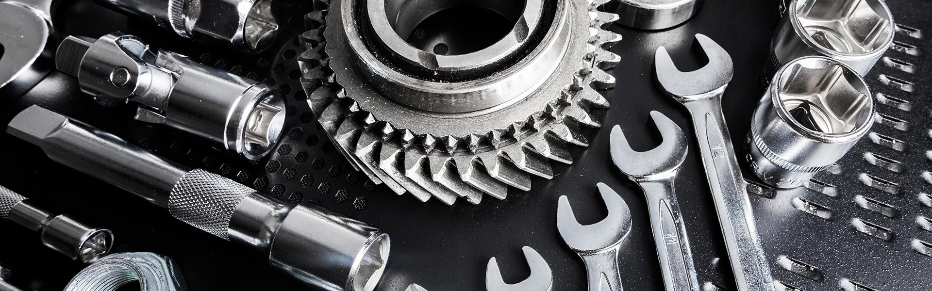 Car parts layed out on grey background